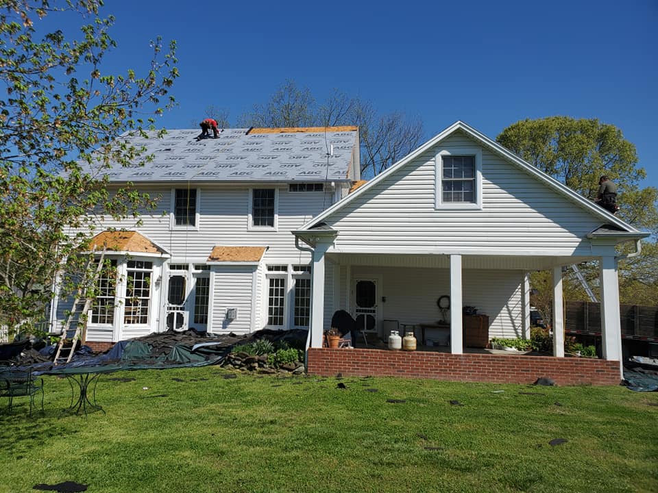Armor Roofing crew working on a residential roof
